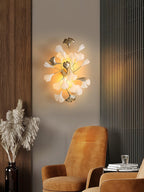 Ceramic ginkgo leaf wall lamp casting a soft glow