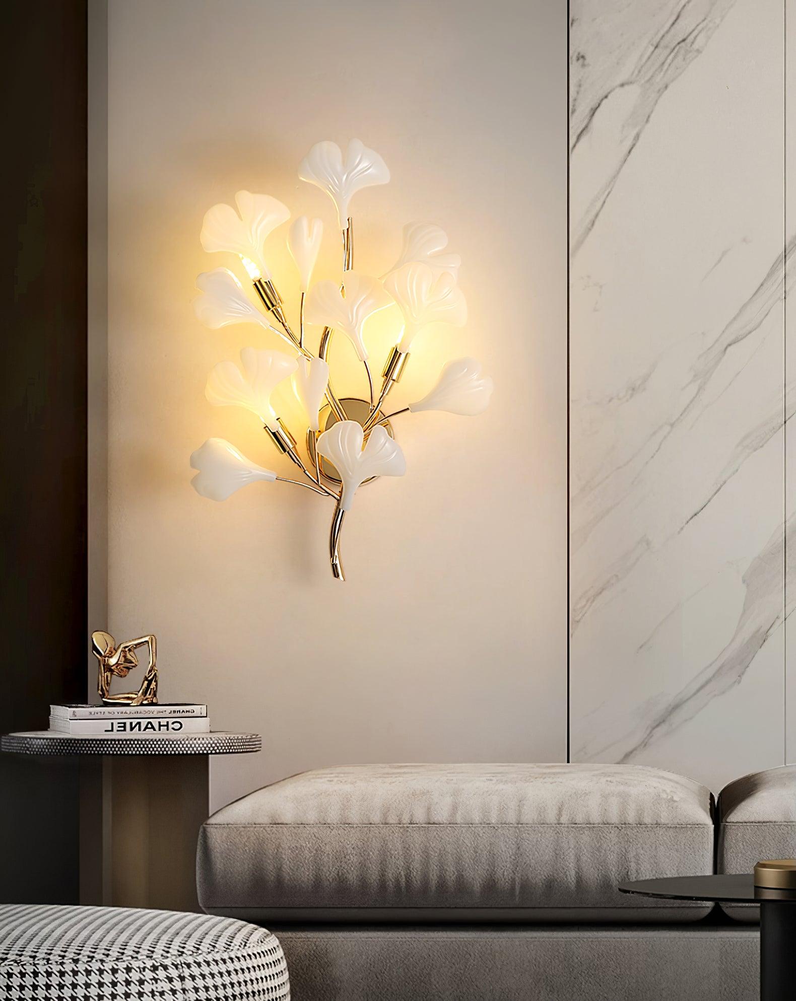 Gold ginkgo leaf wall lamp with white ceramic leaves lit