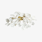 Ceramic ginkgo leaf ceiling lamp with gold finish lit warm