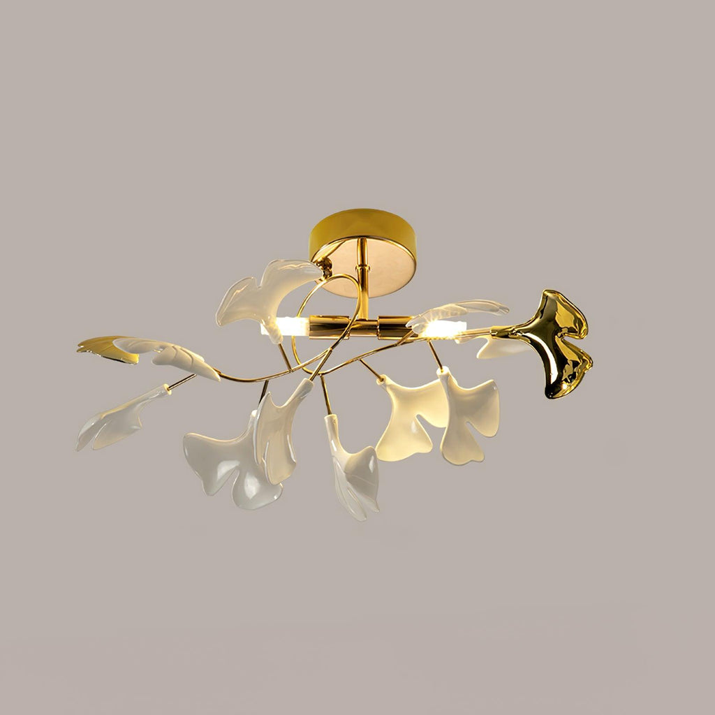Ceramic ginkgo leaf ceiling light glowing warm against a pale wall