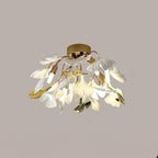 Ginkgo leaf ceiling light lit above a softly furnished room