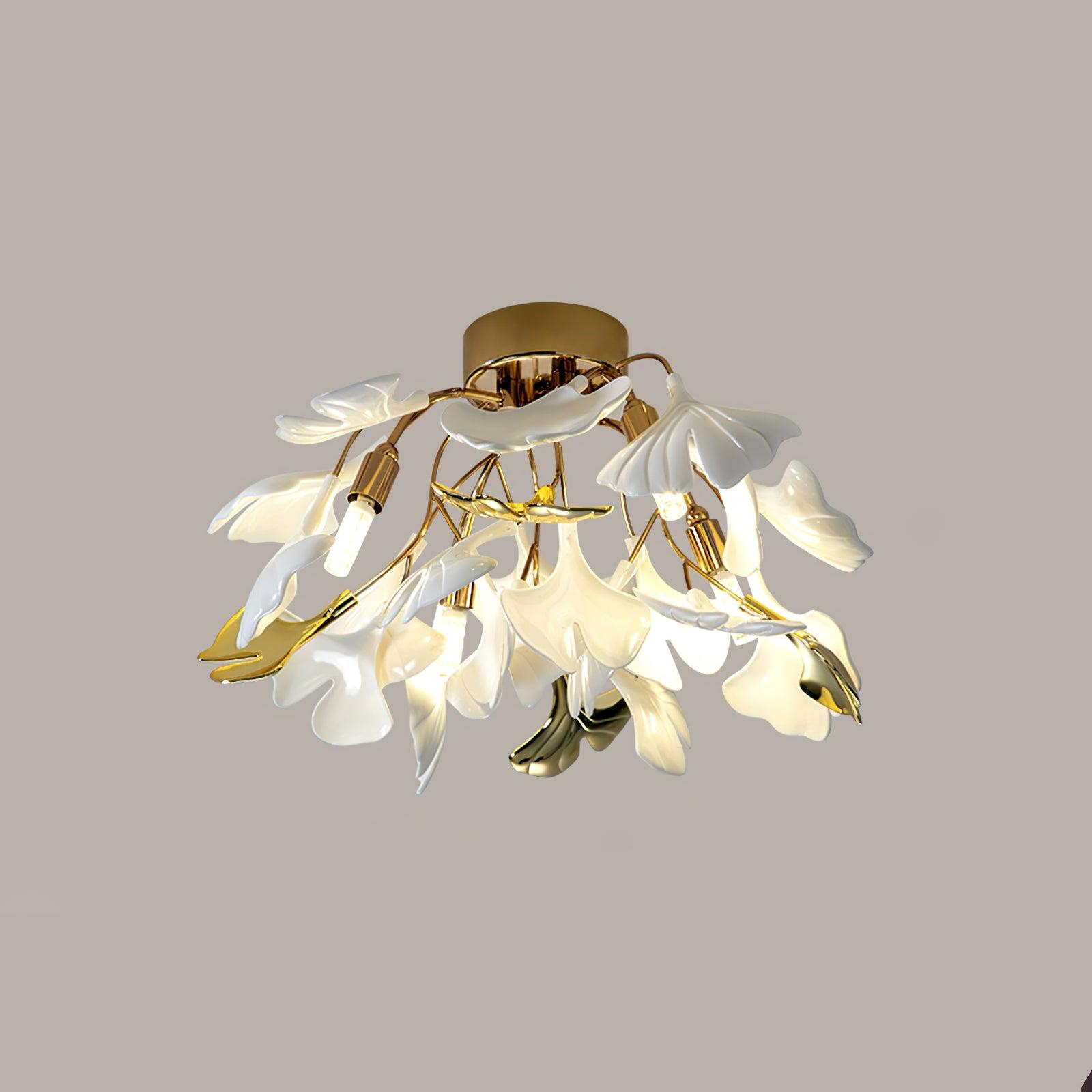 Ginkgo leaf ceiling light lit above a softly furnished room