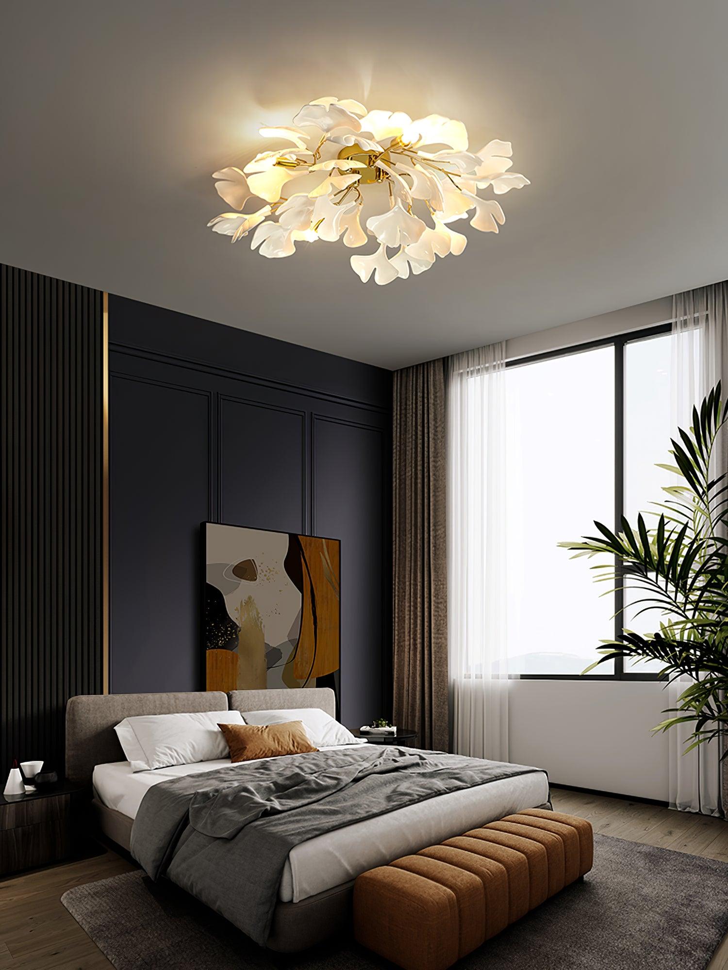 Lit ginkgo leaf ceiling light over a calm seating area