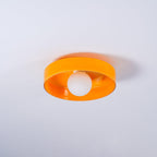 Another angle of this Clérachic orange ceiling light, the white ball unlit beneath the round shade.