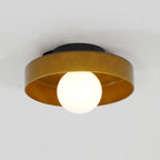 Lit against a plain grey backdrop, this Clérachic ceiling light in warm brown glass glows softly from within.