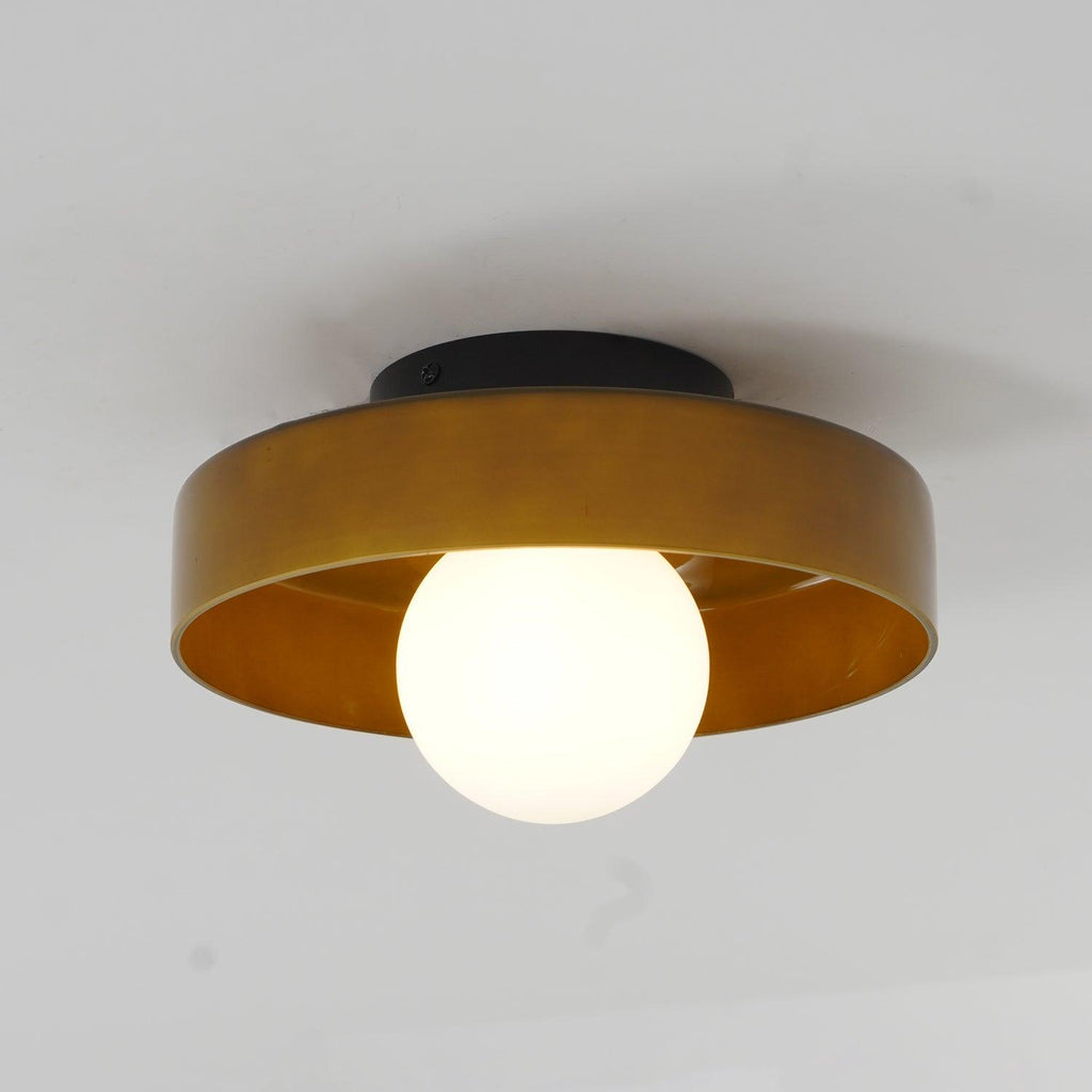 With its ball lit, this Clérachic ceiling light in warm brown glass casts a gentle glow beneath the shade.