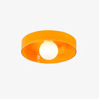 This Clérachic orange ceiling light viewed from below, the shade's reflection catching the studio light.