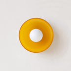 A white disc-shaped wall light, a different mount from this Clérachic ceiling light.
