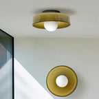 A brown-toned ceiling light and a matching wall light in a stairwell, only the upper one this Clérachic ceiling model.