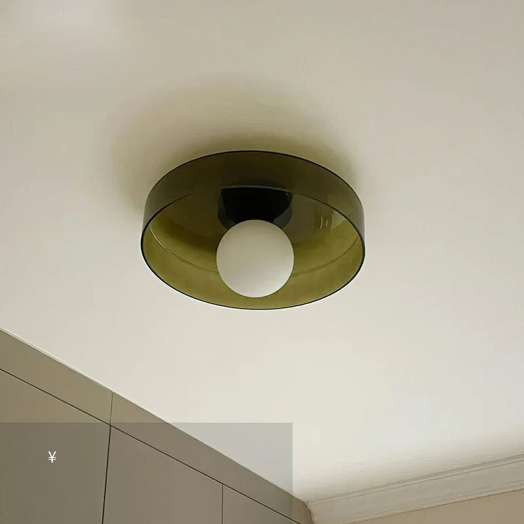 Above a run of pale cabinetry, this Clérachic ceiling light in warm brown glass sits unlit against the ceiling.