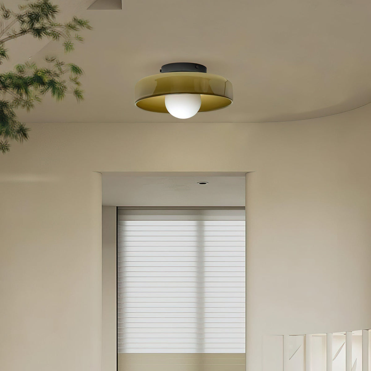 With plant leaves in the corner of the frame, this Clérachic ceiling light in warm brown glass glows warmly overhead.