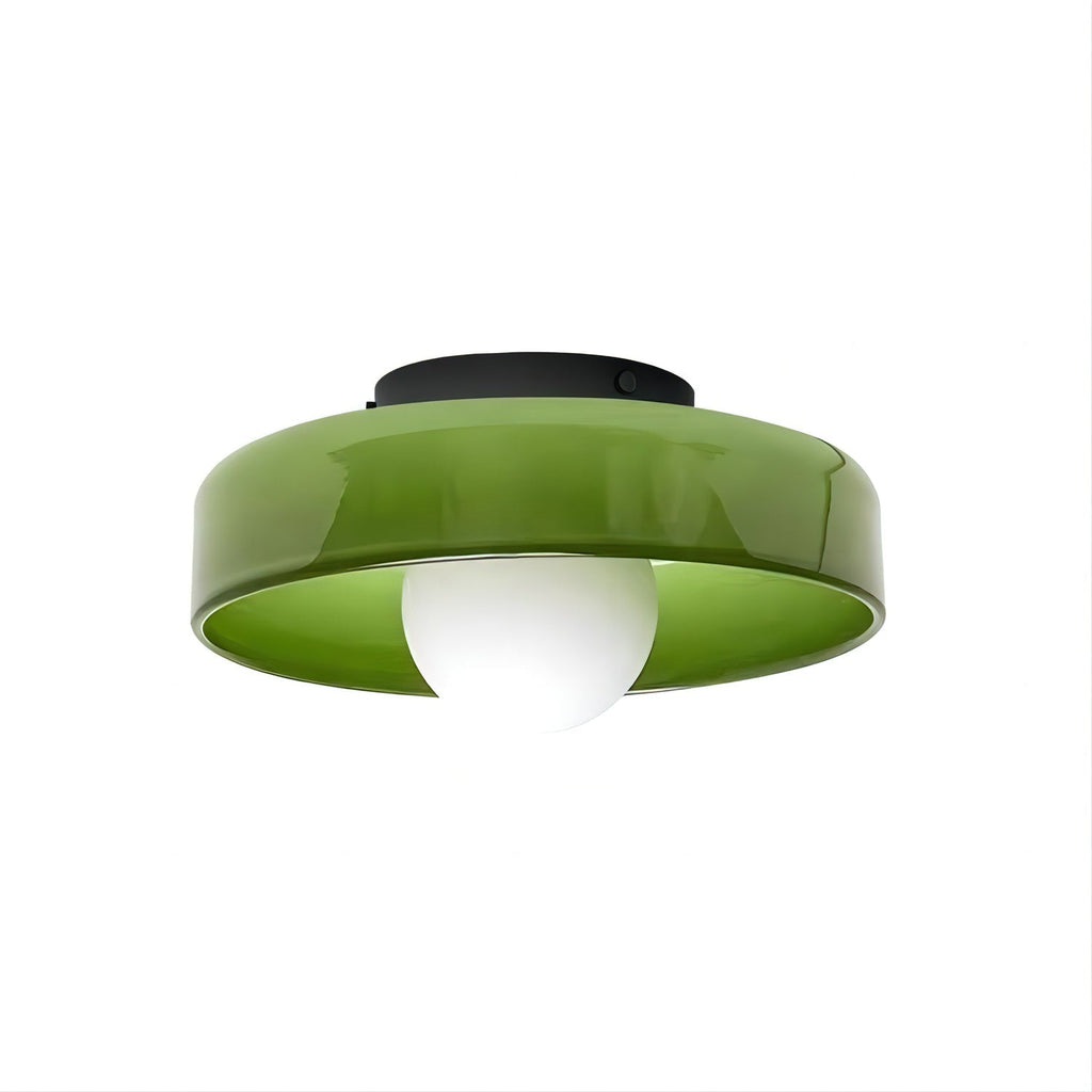 This Clérachic ceiling light in green glass, its dark mounting plate visible, ball unlit against a plain backdrop.