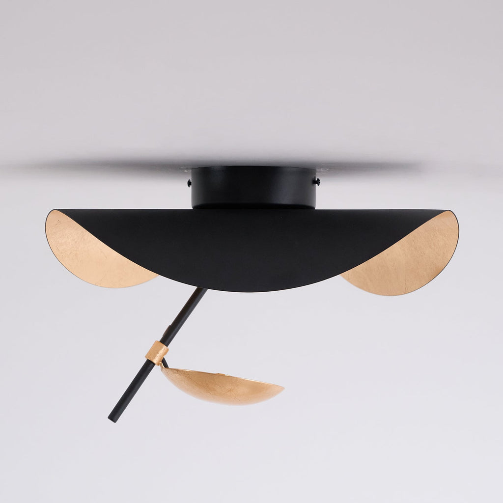 Curved disc ceiling light on a neutral background
