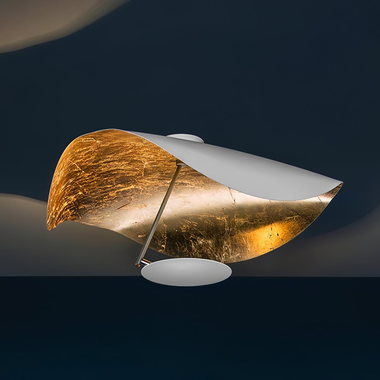 Curved disc ceiling light reaching from a slim rod