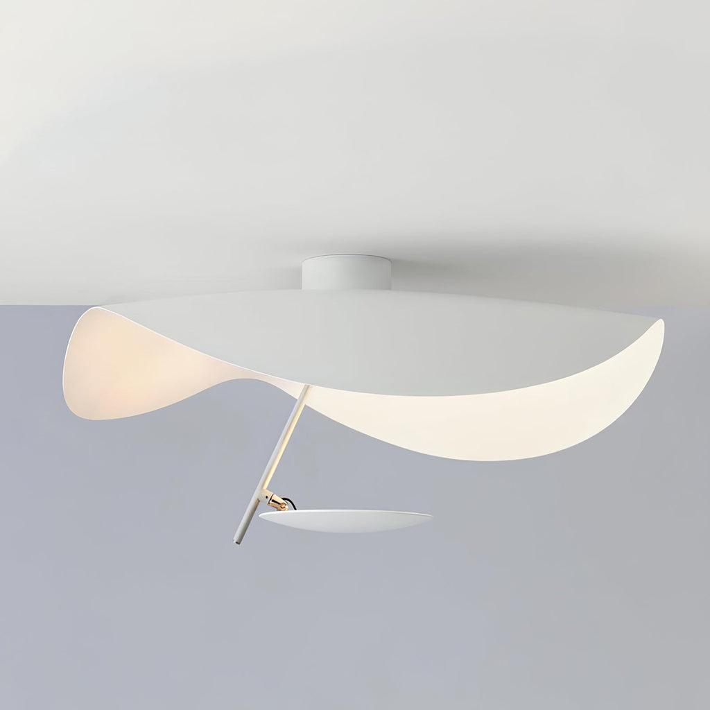 Curved steel disc ceiling light lit warm overhead
