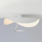 Curved steel disc ceiling light lit warm overhead