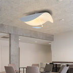 Curved disc ceiling light with a soft downward glow