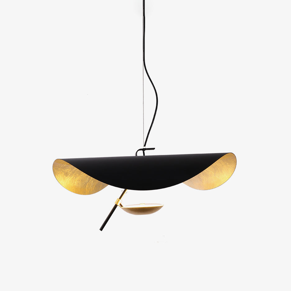 Giorgio disc pendant light glowing over a kitchen island