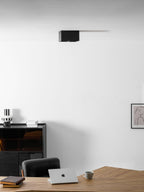 In the office scene again, a single black Clérachic spotlight sits unlit high on the ceiling.