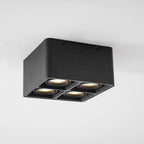 This black four-light Clérachic spotlight is shown at a wider three-quarter angle, unlit on a plain background.