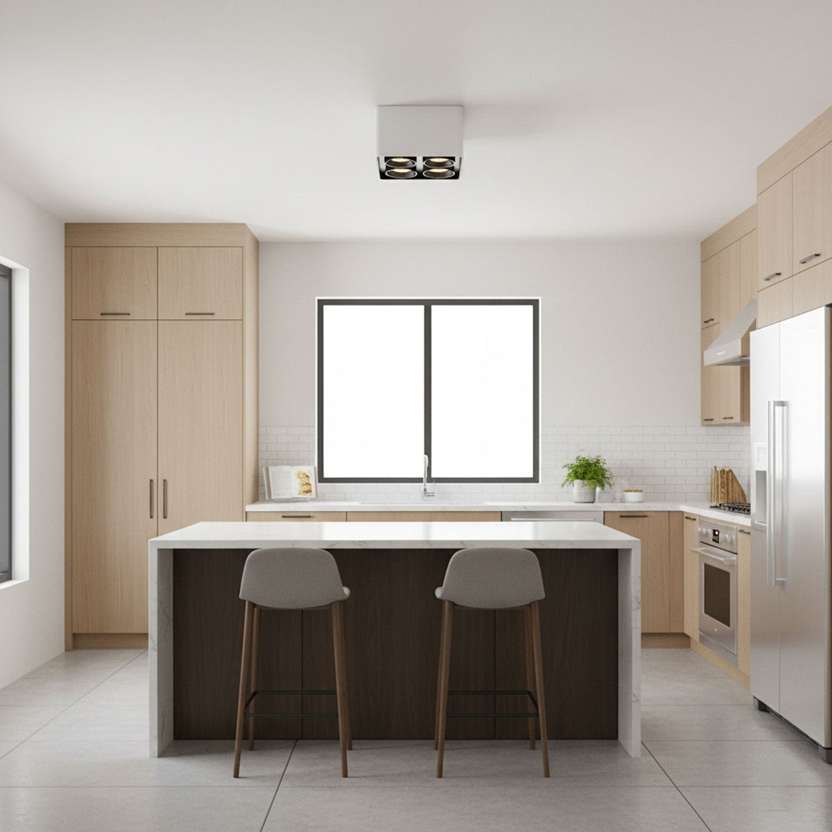 In a kitchen with wood cabinetry, a two-light Clérachic spotlight glows warm from the ceiling.
