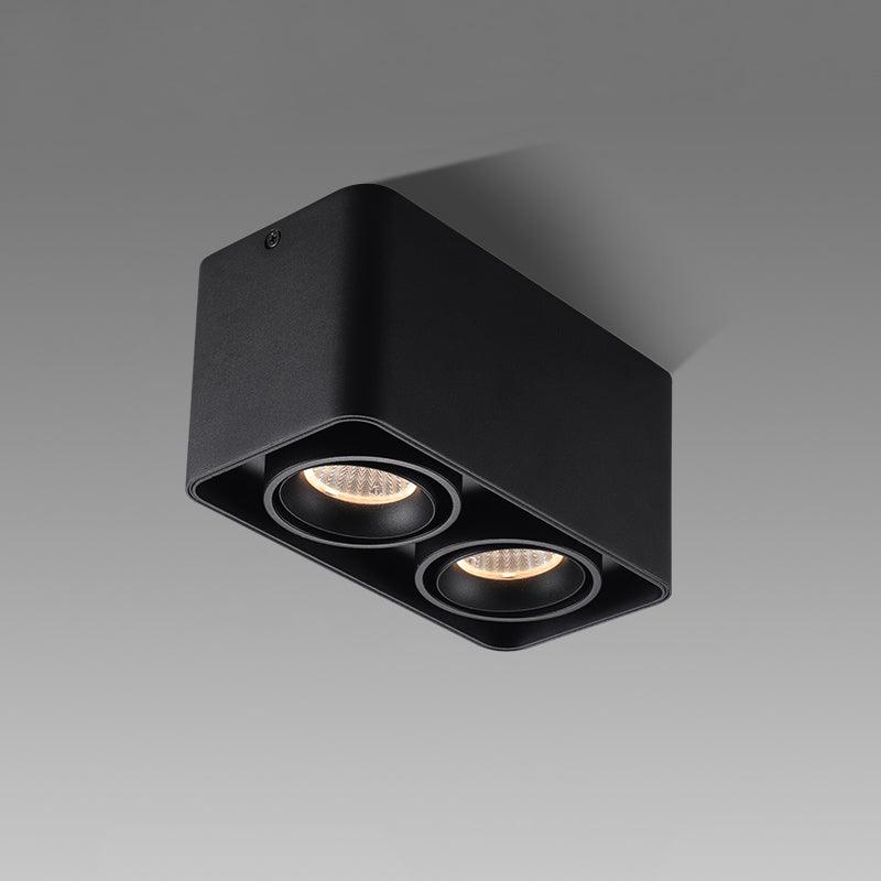 This black two-light Clérachic spotlight is shown unlit at an angle against a plain grey background.