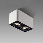 This white two-light Clérachic spotlight is shown unlit at an angle against a plain grey background.