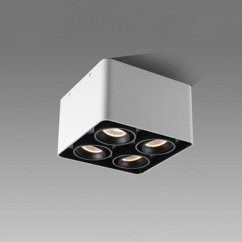 This white four-light Clérachic spotlight is shown unlit at an angle against a plain grey background.
