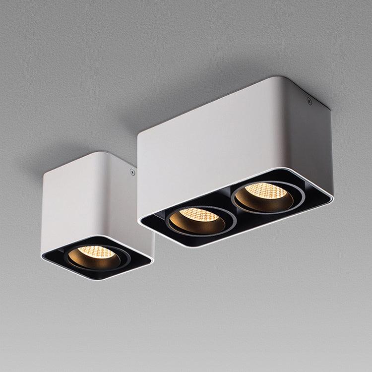 A single-light and a two-light white Clérachic spotlight are shown side by side, both unlit, on a plain background.