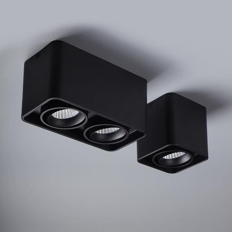 A two-light and a single-light black Clérachic spotlight are shown side by side, both unlit, on a plain background.