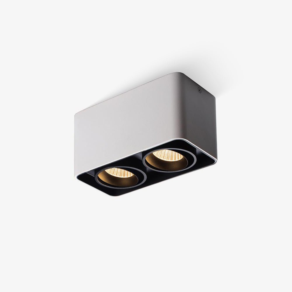 This white two-light Clérachic spotlight is shown unlit at an angle, its black trim visible against a plain backdrop.