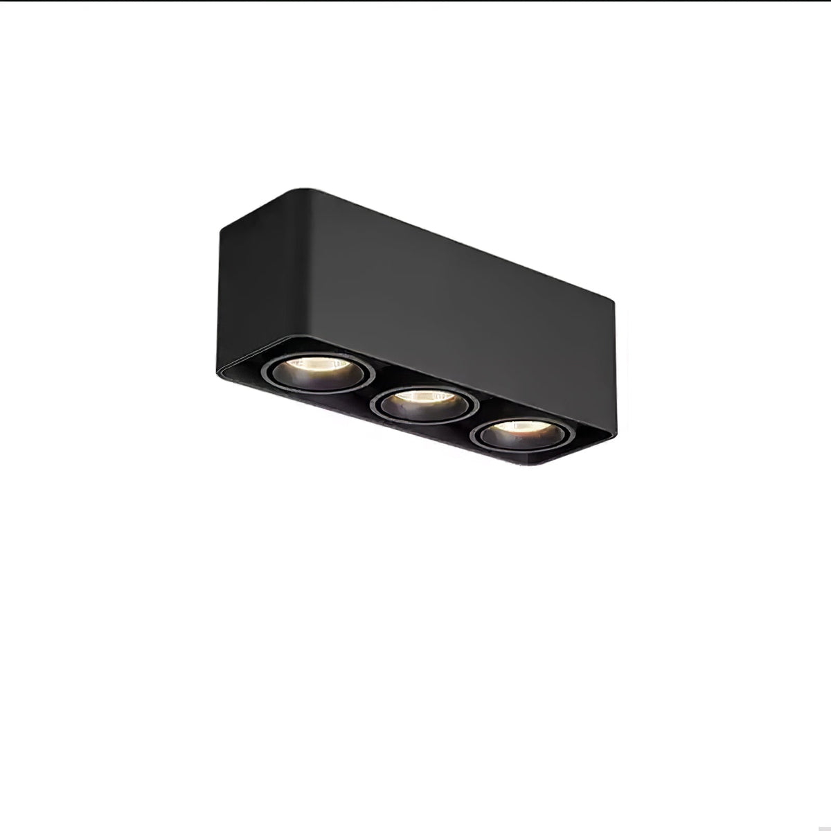 This black three-light Clérachic spotlight glows warm from its three heads, angled on a plain background.