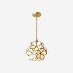 Glass petal pendant lights clustered with warm brass fittings