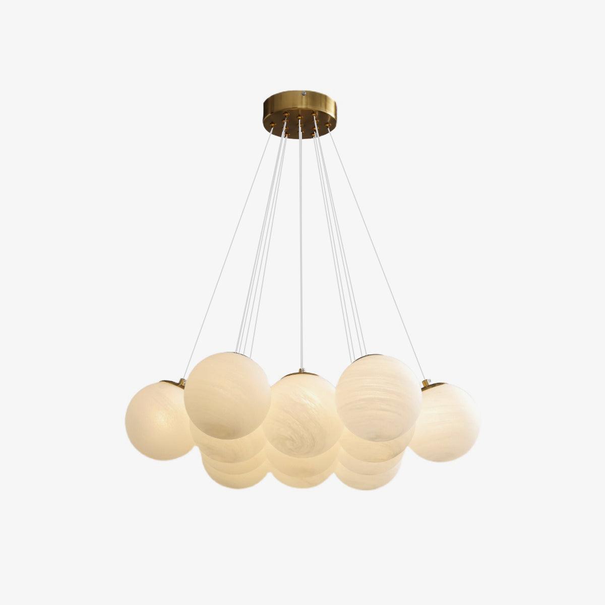Full view of this lit Clérachic cluster chandelier, its gold ceiling plate, fine cords, and clustered frosted globes all visible.