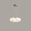 Suspended on fine cords against a plain grey backdrop, this Clérachic cluster chandelier's frosted globes cluster closely together.