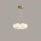 Suspended on fine cords against a plain grey backdrop, this Clérachic cluster chandelier's frosted globes cluster closely together.