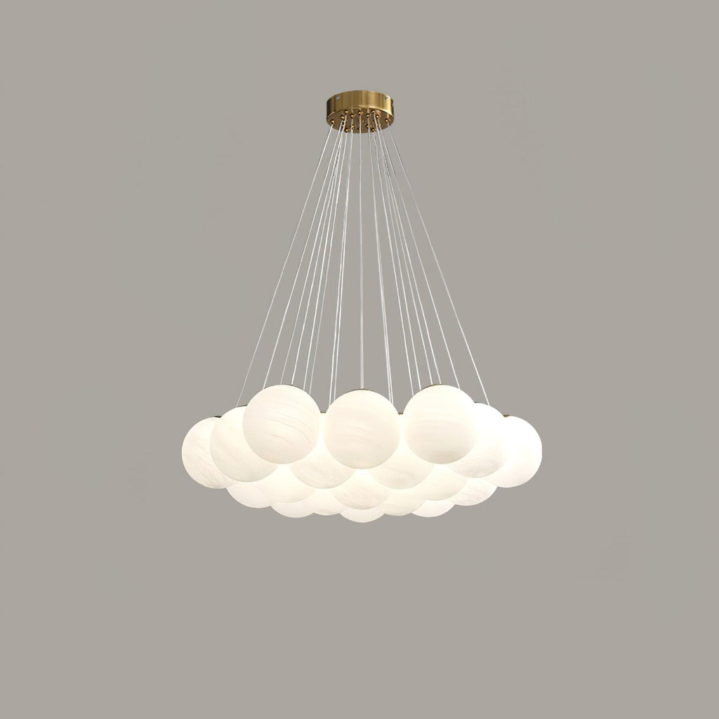 On a grey backdrop, this unlit Clérachic cluster chandelier's frosted globes hang from widely fanned cords.