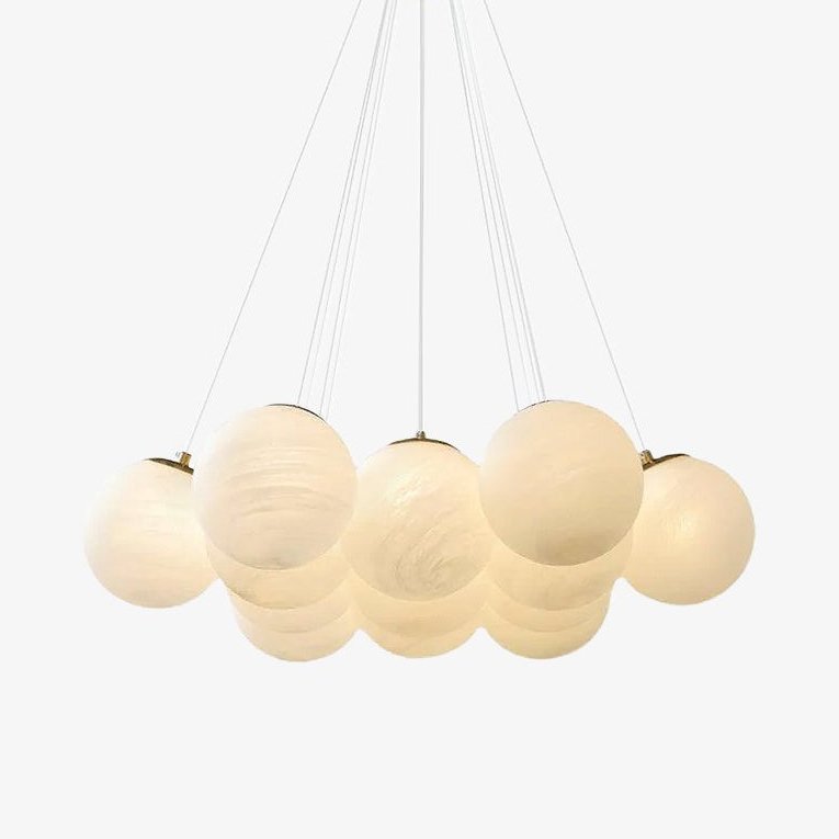 A wider globe cluster on this lit Clérachic cluster chandelier spreads beneath its cords against a plain backdrop.