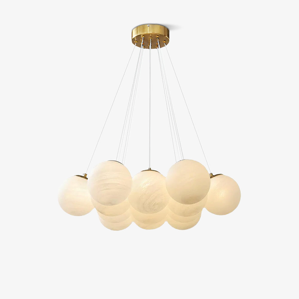 A smaller globe cluster on this lit Clérachic cluster chandelier hangs from a gold plate against a plain backdrop.