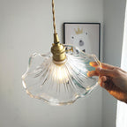 Brass swag light with fluted glass blossom shade detail