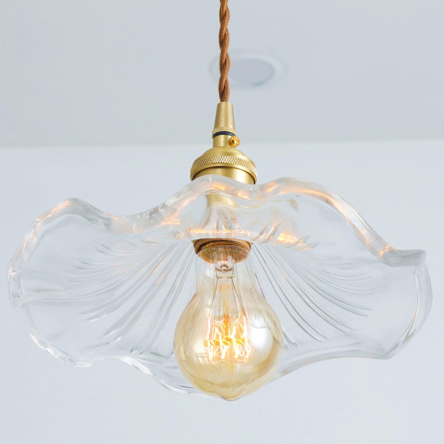 Brushed brass hibiscus pendant light with clear fluted glass shade