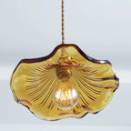 Fluted glass hibiscus pendant light with brushed brass fitting