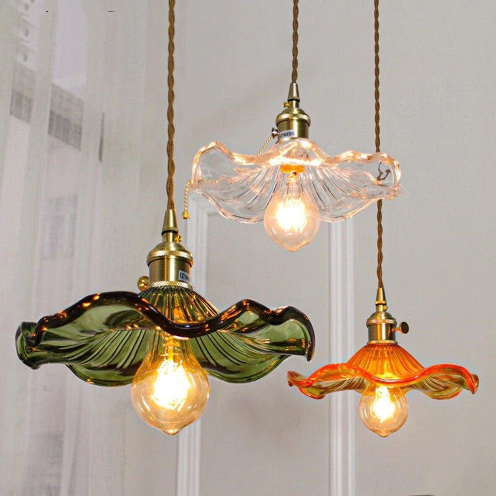 Hibiscus glass pendant light glowing softly in a warm interior