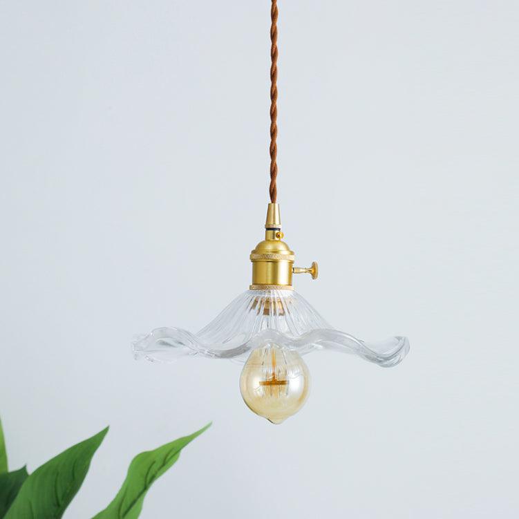 Glass hibiscus flower pendant light with brushed brass holder