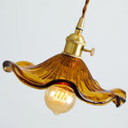 Hibiscus glass swag light with fluted blossom shade lit warmly
