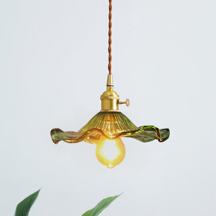 Fluted glass hibiscus pendant light glowing in a dining nook