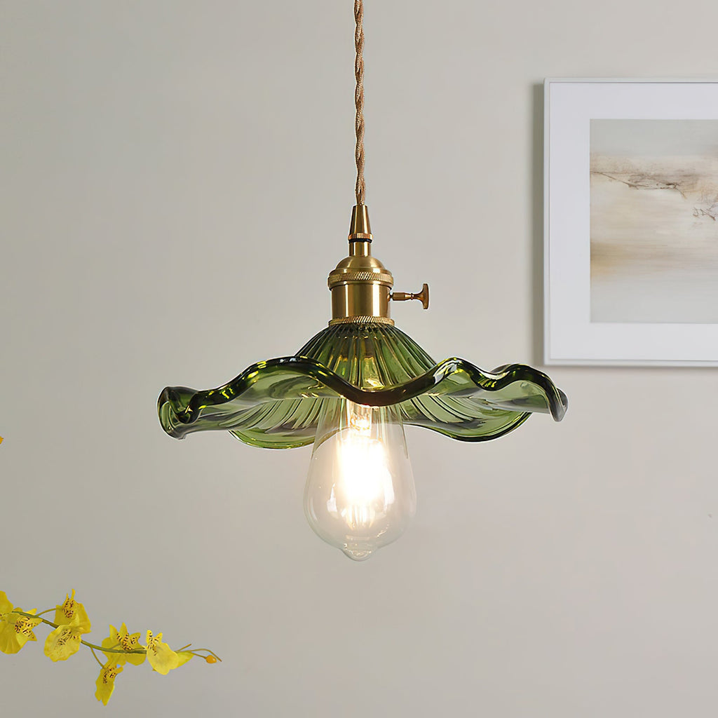 Fluted glass flower pendant light with warm filament bulb glow