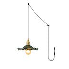 Glass hibiscus swag light hung from a ceiling hook