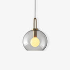 Glass pendant light cluster with copper-plated bodies and warm glow