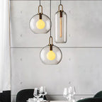 Glass pendant light shade detail showing copper-plated cap
